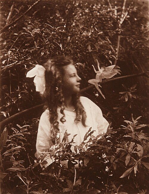 Cottingley Fairies photograph showing a girl and a staged fairy